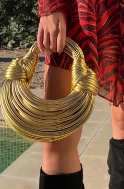 BOLSO NUDOS DORADO