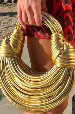 BOLSO NUDOS DORADO