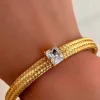 PULSERA DORADA DE ACERO CRISTAL CLEAR