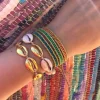PULSERA O TOBILLERA COWRIE DORADA 24K