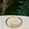 PULSERA TORNILLO ACERO DORADA